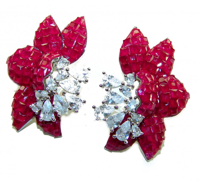 Giovanna - Authentic 22.9 carat Ruby .925 Sterling Silver handcrafted earrings - Ruby and diamond earrings, top view, featuring floral design.