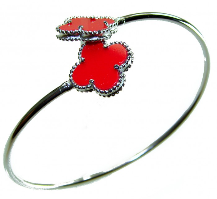 A Red four-leaf clover Coral .925 Sterling Silver handcrafted Bracelet - Silver bracelet with red clover charms, side view.
