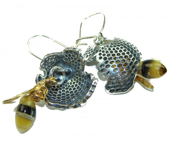 Very Special product - Wonderful Bees Baltic Amber .925 Sterling Silver entirely handcrafted earrings - Close-up of bee earrings with honeycomb detail and amber accents.
