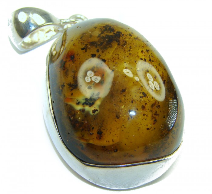 Prehistoric Authentic Baltic Amber .925 Sterling Silver beautifully handcrafted Pendant - Close-up of prehistoric Baltic amber pendant in sterling silver setting.