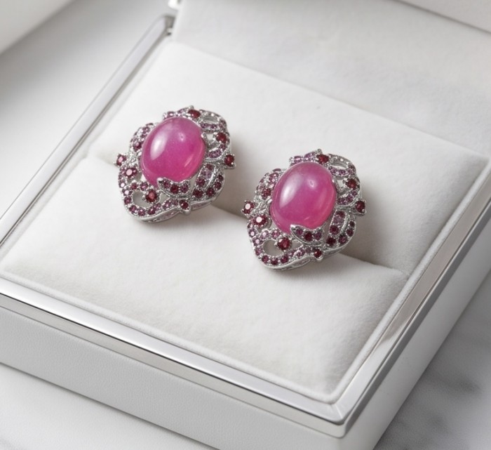 Francesca- Magnificent 10.8 carat authentic Ruby rhodium over .925 Sterling Silver handcrafted Statement earrings - Ruby earrings in display box, top view showing intricate design.