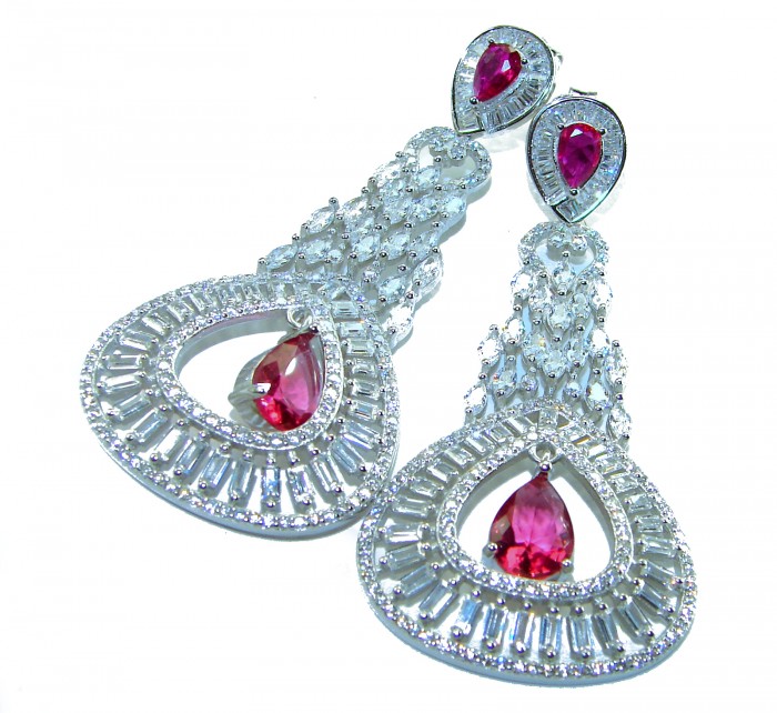 Pure Luxury 22.2 carat natural Ruby .925 Sterling Silver handmade Statement earrings - Close-up of ruby and sterling silver earrings with teardrop design.
