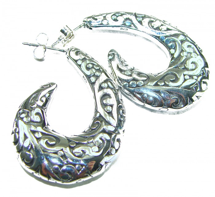 1 5/8 inches long - Free Spirit bohemian Style .925 Sterling Silver handmade Bali made Oversized Earrings - Ornate crescent-shaped silver earrings with intricate design, top view.