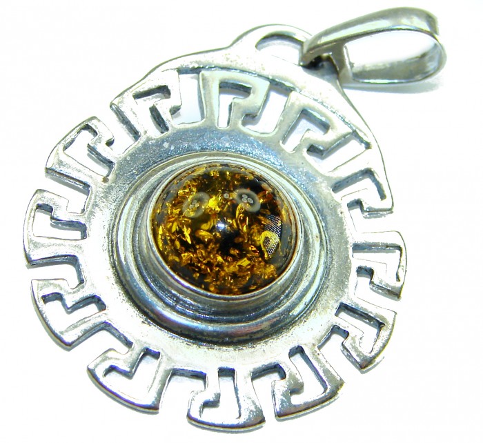 Prehistoric Authentic Baltic Amber .925 Sterling Silver beautifully handcrafted Pendant - Silver pendant with amber detail, top view.