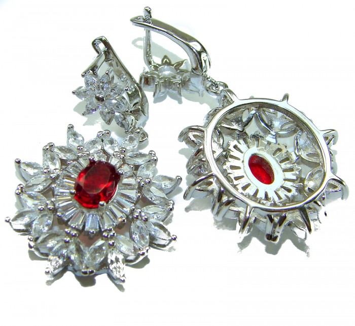 Magnificent Jewel 8.5 carat Ruby .925 Sterling Silver handcrafted incredible earrings - Close-up of earrings with ruby center and sterling silver detailing