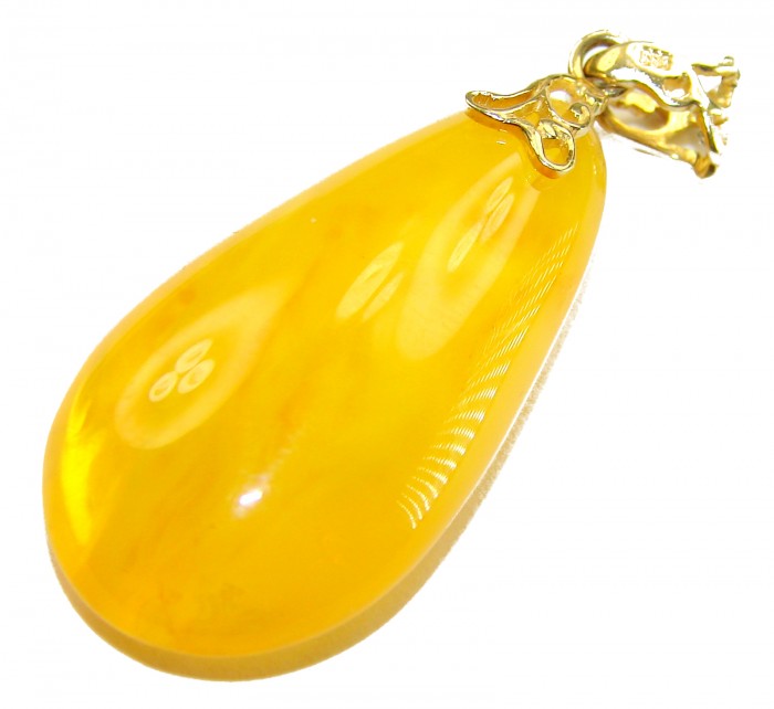 Prehistoric Authentic Baltic Amber REAL 14k Gold beautifully handcrafted Pendant - Close-up of Baltic amber pendant with 14k gold detail.