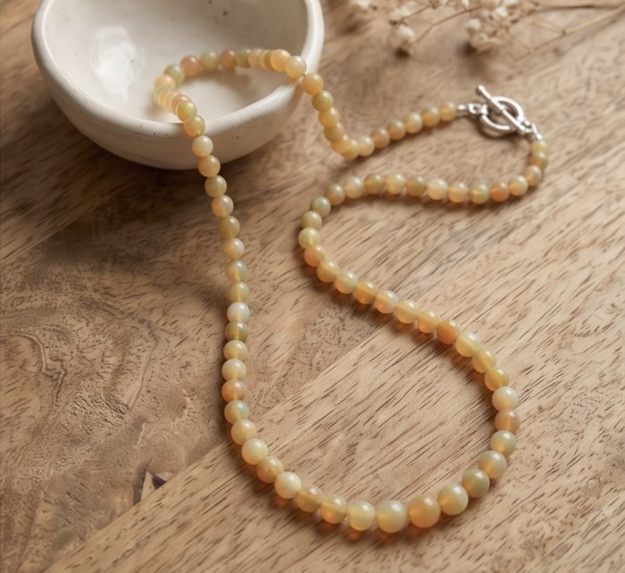 Real Masterpiece Natural Ethiopian Opal .925 Sterling Silver Necklace - Ethiopian opal necklace on wood, showing clasp side view.