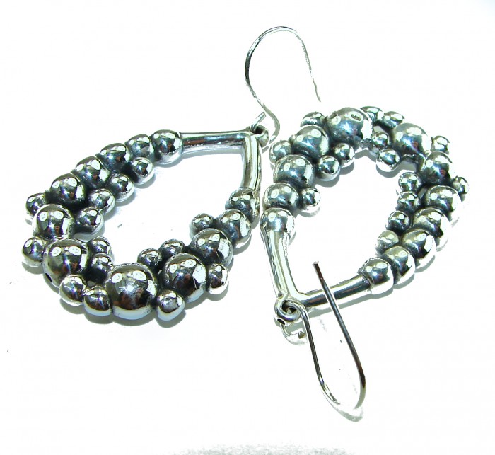 Fancy .925 Sterling Silver Italy made Earrings - Close-up of fancy .925 sterling silver earrings with beaded design.