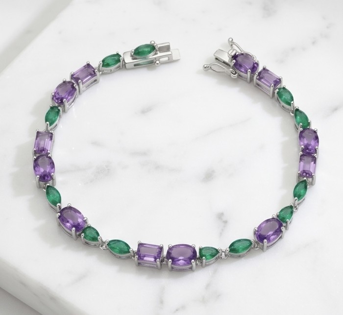 A Heritage in Bloom - Italy made 14.7 carat Amethyst Chrome Diopside .925 Sterling Silver handcrafted bracelet - Bracelet with amethyst and chrome stones on marble background.