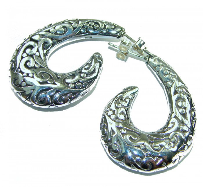 1 5/8 inches long - Free Spirit bohemian Style .925 Sterling Silver handmade Bali made Oversized Earrings - Curved silver earrings with intricate design, side view.