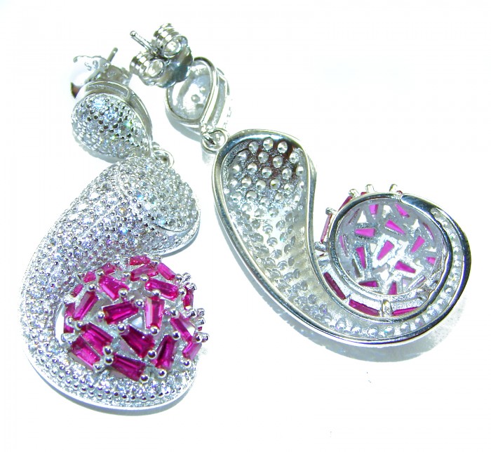 Pure Luxury 22.2 carat natural Ruby .925 Sterling Silver handmade Statement earrings - Front view of silver earrings with ruby stones and intricate design.