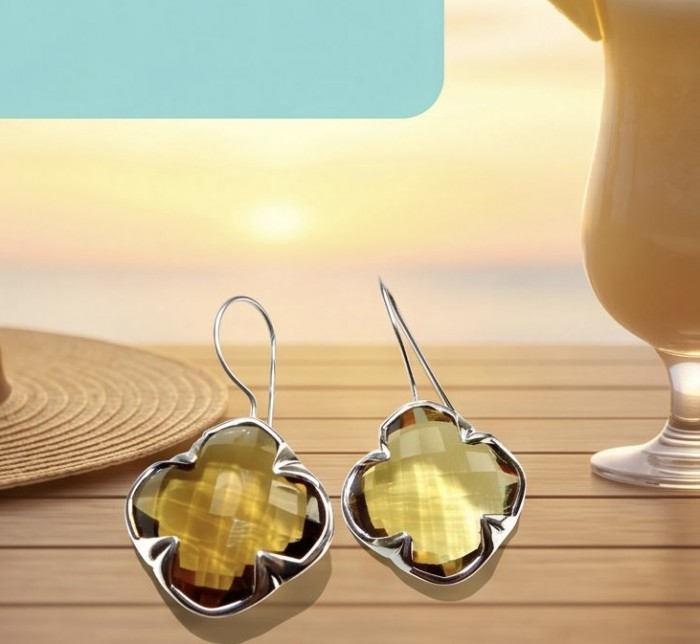 Colden Clover 22.5 carat Champagne Smoky Topaz .925 Sterling Silver handmade Earrings - Close-up of clover-shaped smoky topaz earrings on a table.