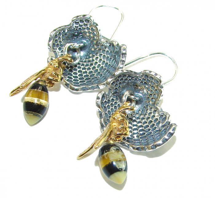 Very Special product - Wonderful Bees Baltic Amber 18K Gold over .925 Sterling Silver entirely handcrafted earrings - Earrings with bees and honeycomb design, shown in close-up detail.