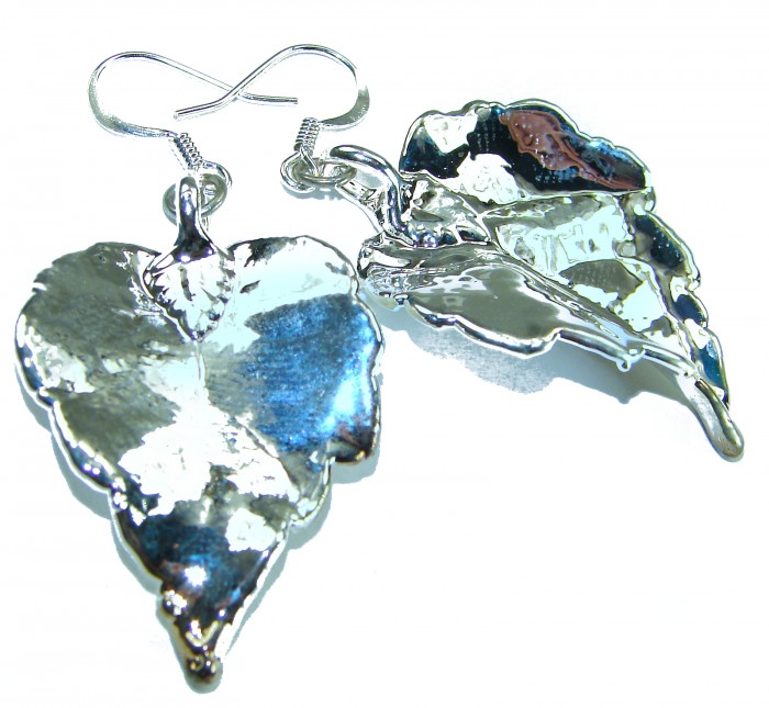 Real Japanese Maple Leaves .925 Sterling Silver and real Gold earrings - Leaf-shaped silver earrings, angled view, with intricate detailing