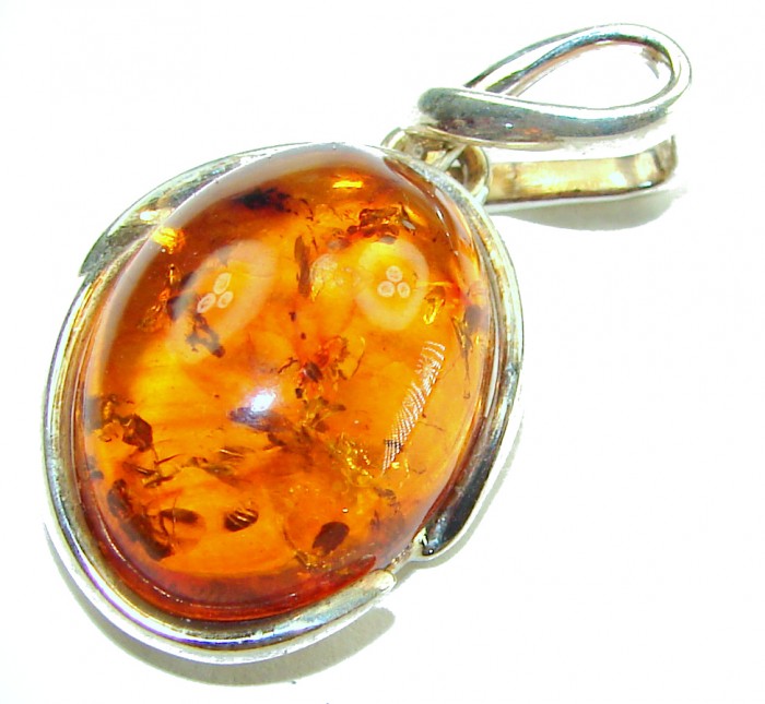 Prehistoric Authentic Baltic Amber .925 Sterling Silver beautifully handcrafted Pendant - Close-up of prehistoric Baltic amber in sterling silver setting.