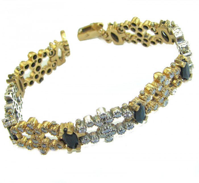 Gabriella 22.2 carat authentic Sapphire rhodium over .925 Sterling Silver handcrafted Statement Bracelet - Gold and silver bracelet with sapphires, side view.