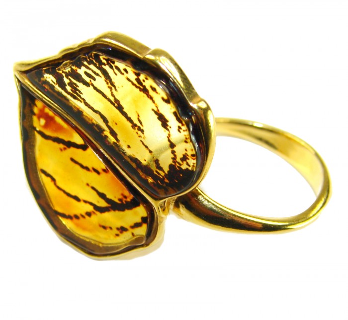 Authentic carved Baltic Amber .925 Sterling Silver dipped in 18K Gold handcrafted ring; s. 8 adjustable - Close-up of a Baltic Amber ring, side view, in sterling silver dipped.