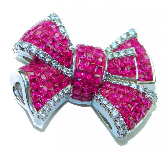 Heirloom blue Bow Genuine 17.5 carat Ruby .925 Sterling Silver handmade Pendant - Close-up of heirloom bow jewelry with rubies and sterling silver.