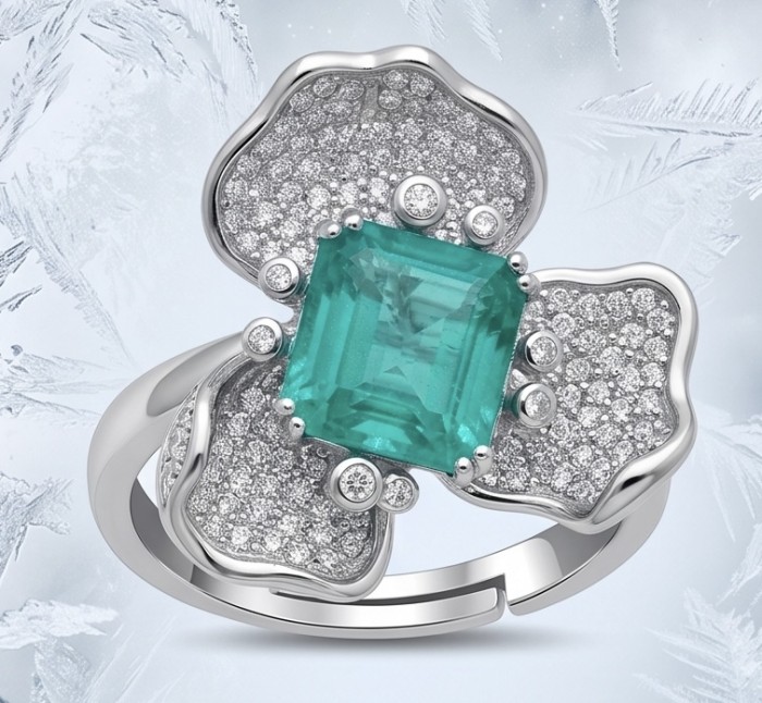 Elizabeth 8.8 carat Colombian Emerald 8.2 carat Moissanite .925 Sterling Silver dipped in Rhodium handcrafted Ring size 8 - Emerald ring with moissanite, front view against icy background.