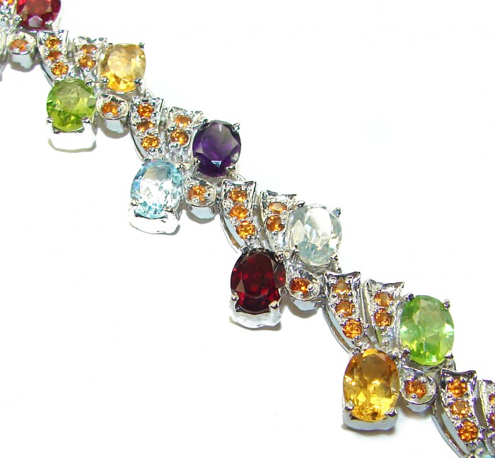One of the kind 48.5 carat genuine Multigem Rhodium over .925 Sterling Silver Bracelet - Close-up of colorful multigem bracelet showcasing stones and settings.
