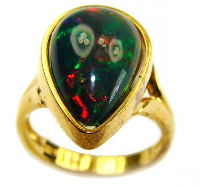 A COSMIC POWER Genuine 14.2 carat Black Opal 18K Gold over .925 Sterling Silver handmade Ring size 7 1/2 - Close-up of black opal ring in 18K gold showing vibrant colors