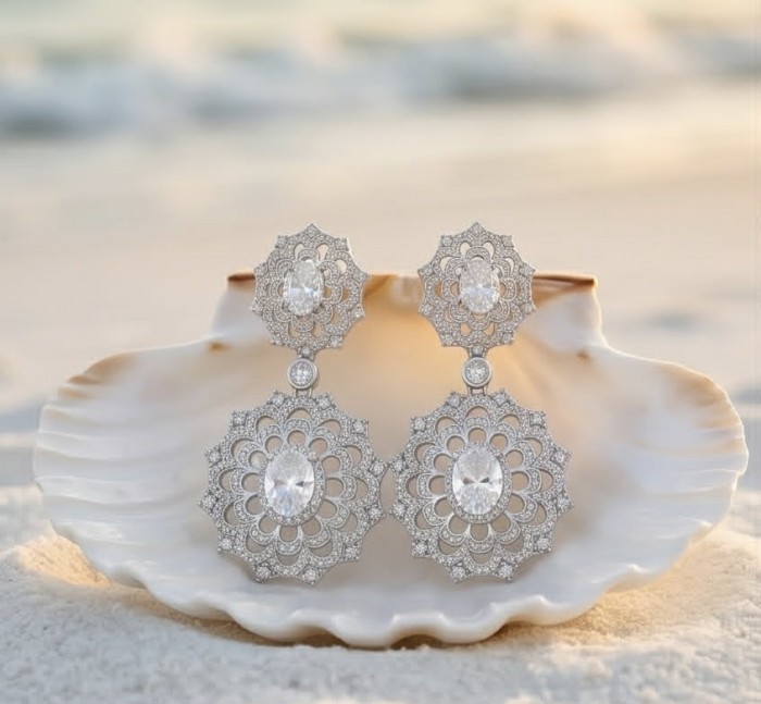 Elizabeth Natural 8.2 carat White Topaz .925 Sterling Silver handcrafted earrings - Front view of Elizabeth sterling silver earrings in a seashell display.