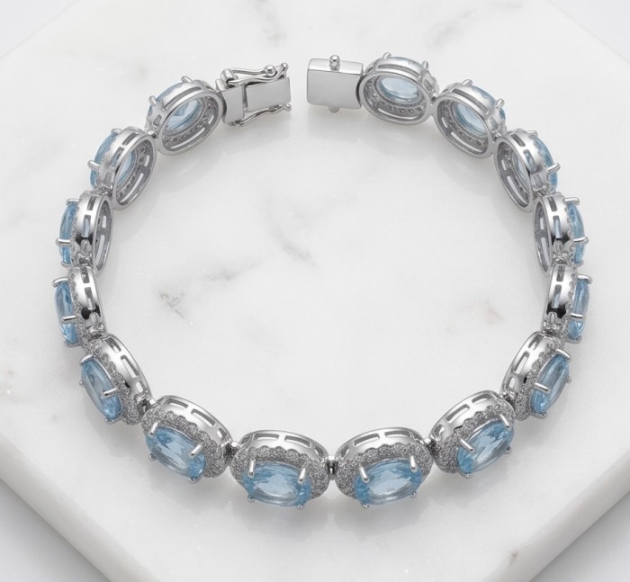 Tiffany - Magnificent 41.5 carat Swiss Blue Topaz .925 Sterling Silver handcrafted Bracelet - Blue topaz bracelet on marble surface, top view.