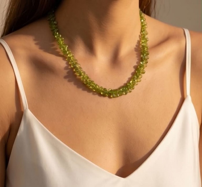 Melissa - Great Masterpiece 55.7 carat genuine Brazilian Peridot .925 Sterling Silver handmade Statement necklace - Woman wearing green gemstone necklace, front view close-up.
