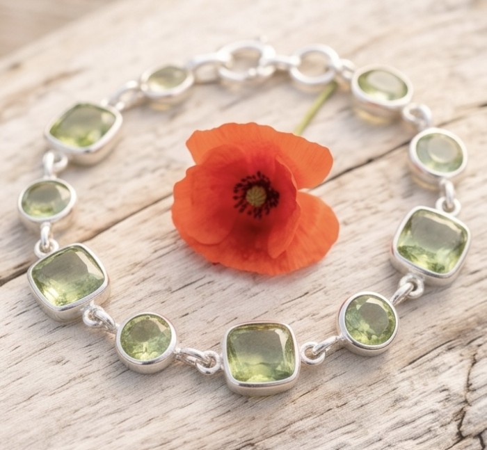 Tutti Frutti 17.5 CARAT Green Amethyst .925 Sterling Silver brilliantly handcrafted Bracelet - Green amethyst bracelet with poppy flower, top view on wooden surface.