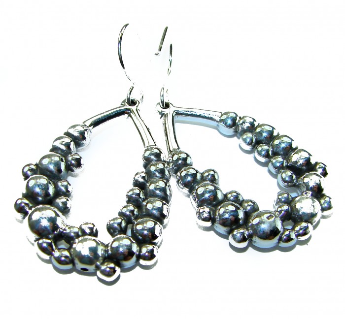 Fancy .925 Sterling Silver Italy made Earrings - Close-up of fancy .925 sterling silver earrings with beaded design.