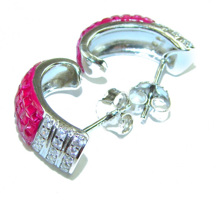 Real Beauty natural mystery setting 14.2 carat Ruby .925 Sterling Silver handcrafted earrings - Side view of ruby and diamond stud earrings in silver setting.