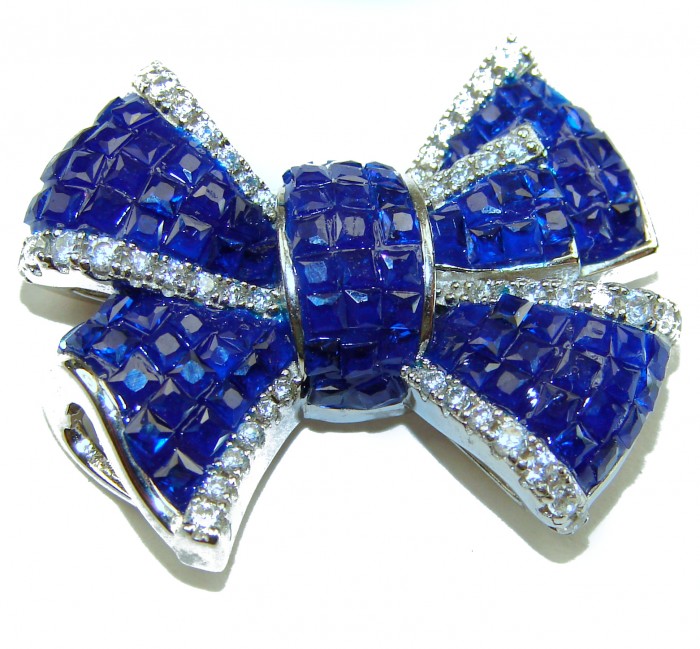 Heirloom blue Bow Genuine 17.5 carat Sapphire .925 Sterling Silver handmade Pendant - Close-up of blue sapphire bow brooch in sterling silver, front view.