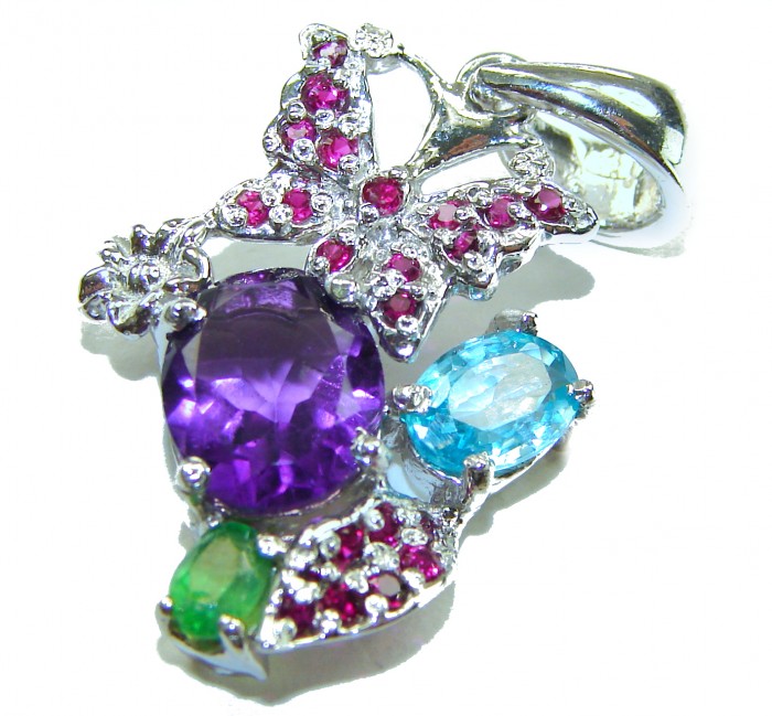 Mademoiselle - 12.5 carat natural Amethyst .925 Sterling Silver handcrafted Pendant - Close-up of amethyst pendant with butterfly design and colorful gemstones.