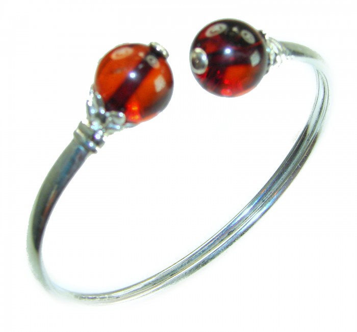 Golden Butterfly Genuine Baltic Amber .925 Sterling Silver handamde Bracelet - Bracelet with amber beads, top angle view, sterling silver band.