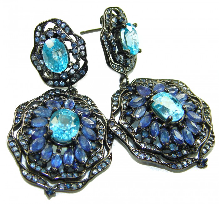 Atlantica 4.7 carat Swiss Blue Topaz .925 Sterling Silver dipped in black rhodium Handcrafted Statement earrings - Close-up of Atlantica earrings with blue topaz and silver detailing.
