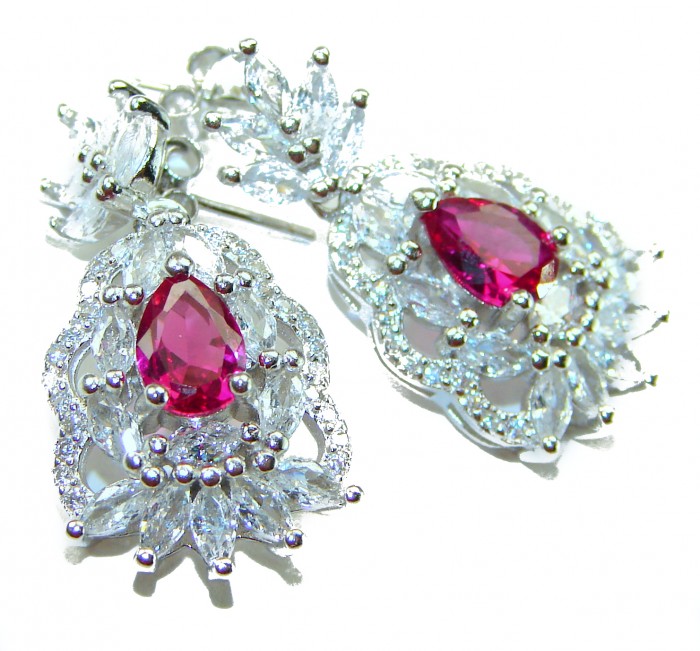 Magnificent Jewel 10.5 carat Ruby .925 Sterling Silver handcrafted incredible earrings - Ruby earrings with intricate silver detailing, top view close-up.