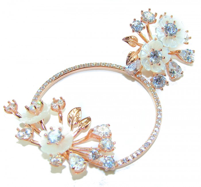 White Garden 15.5 carat White Topaz .925 Sterling Silver dipped in Rose Gold handcrafted pendant - White Garden silver ring with white topaz, floral design close-up.