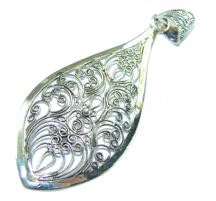 Bali Spirit Large Sterling Beauty .925 Silver Bali handmade Pendant - Bali Spirit sterling silver pendant with intricate filigree, angled view.