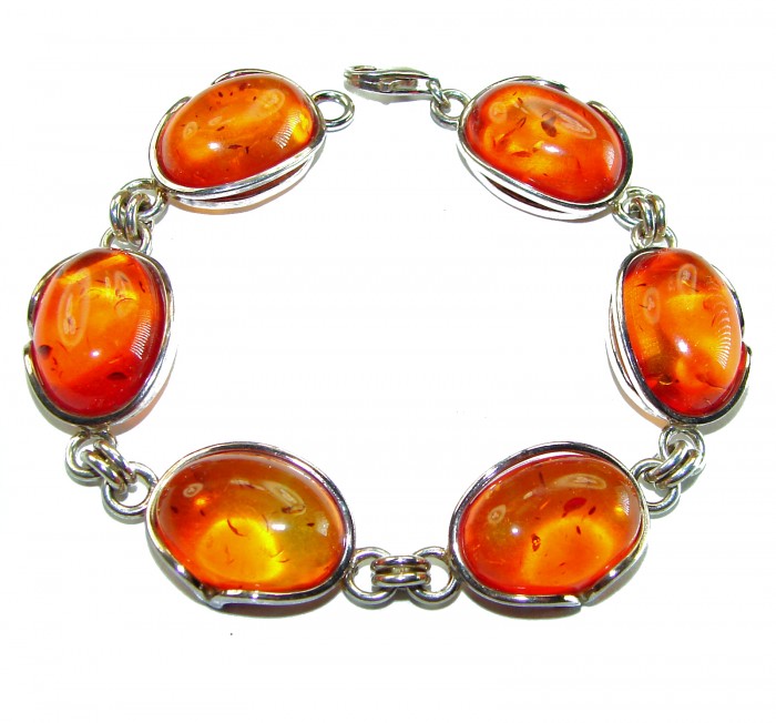 Excellent quality Baltic Amber .925 Sterling Silver entirely handcrafted Bracelet - Bracelet with oval Baltic amber stones in silver settings, top view.