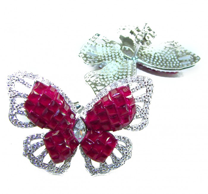 Large - 18.5 carat natural Ruby Butterflies .925 Sterling Silver Large handcrafted earrings - Butterfly brooch close-up with ruby stones and sterling silver detailing.