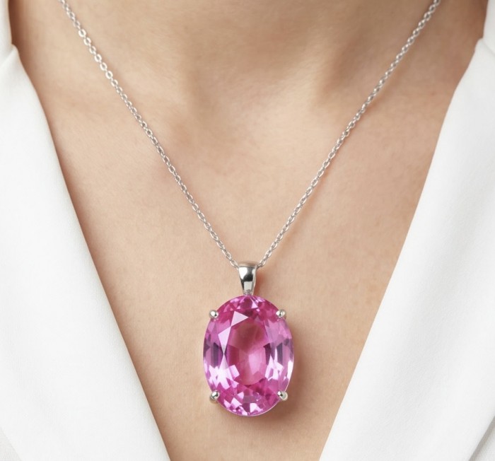 Incredible oval cut 30.8 carat Bubblegum Pink Sapphire .925 Sterling Silver handcrafted pendant - Pink sapphire necklace worn on neck, front view