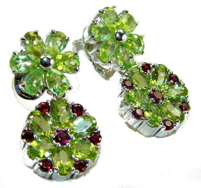 Mint Whisper - Great Masterpiece 32.2 carat genuine Peridot .925 Sterling Silver handmade Statement earrings - Close-up of earrings with green Peridot and red gemstones.