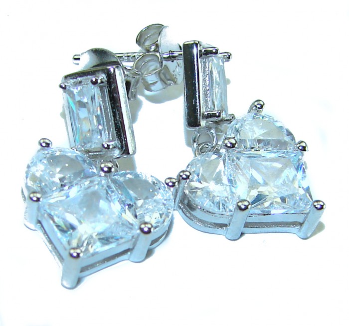 Passion Heart 8.8 carat Authentic White Topaz .925 Sterling Silver Handcrafted earrings - Close-up of heart-shaped white topaz earrings in silver setting.