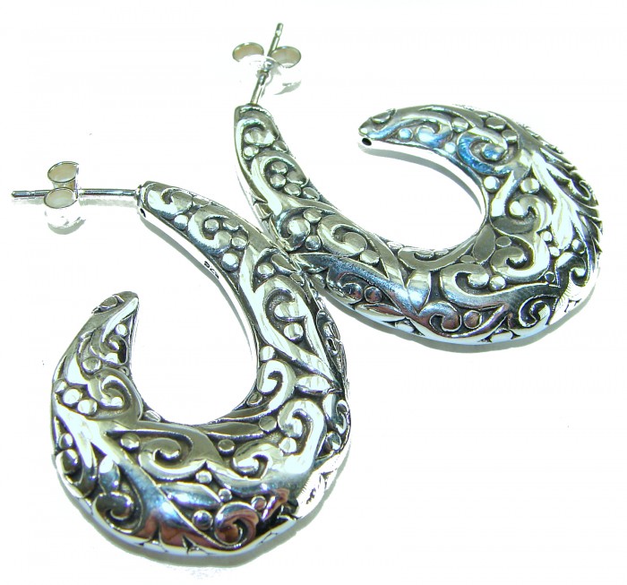 1 5/8 inches long - Free Spirit bohemian Style .925 Sterling Silver handmade Bali made Oversized Earrings - Bohemian silver earrings with intricate design, angled side view.