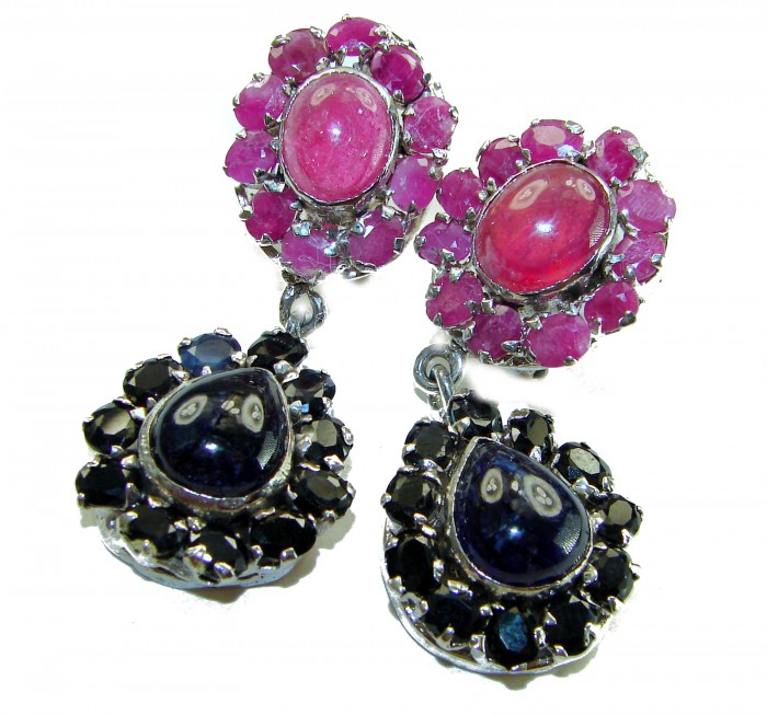 Giovanna - Very Unique - 29.5 carat Sapphire Ruby .925 Sterling Silver dipped in rhodium handcrafted earrings - Close-up of ruby and sapphire earrings with silver setting.