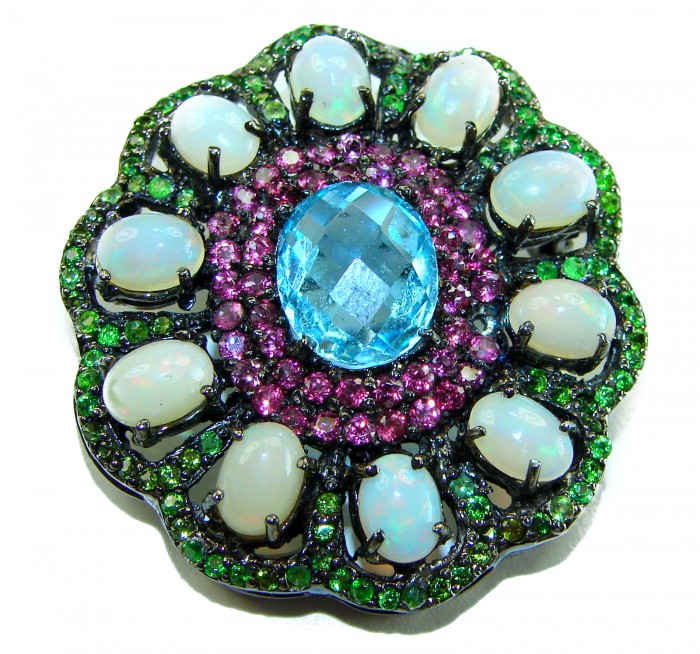 Costa del Sol oval cut 27.8 carat Ethiopian Opal Swiss Blue Topaz .925 Sterling Silver Handcrafted Pendant - Close-up of Costa del Sol pendant with opal and blue gemstone.