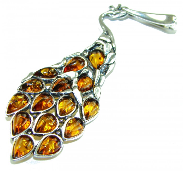 2 7/8 inches! Peacock Prehistoric Authentic Baltic Amber .925 Sterling Silver beautifully handcrafted Pendant - Peacock pendant with amber stones, angled view showing detailed feathers.