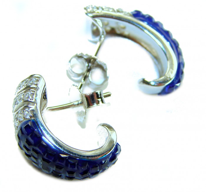 Born to Glam authentic 10.5 carat Sapphire .925 Sterling Silver handcrafted earrings - Close-up of sapphire and sterling silver earrings from side angle.