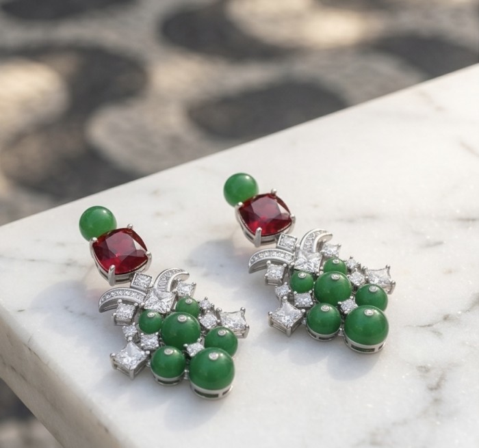Francesca - Luxurious natural 39.8 carat Ruby Emerald rhodium over .925 Sterling Silver handmade Statement earrings - Close-up of Francesca ruby emerald earrings on a marble surface.