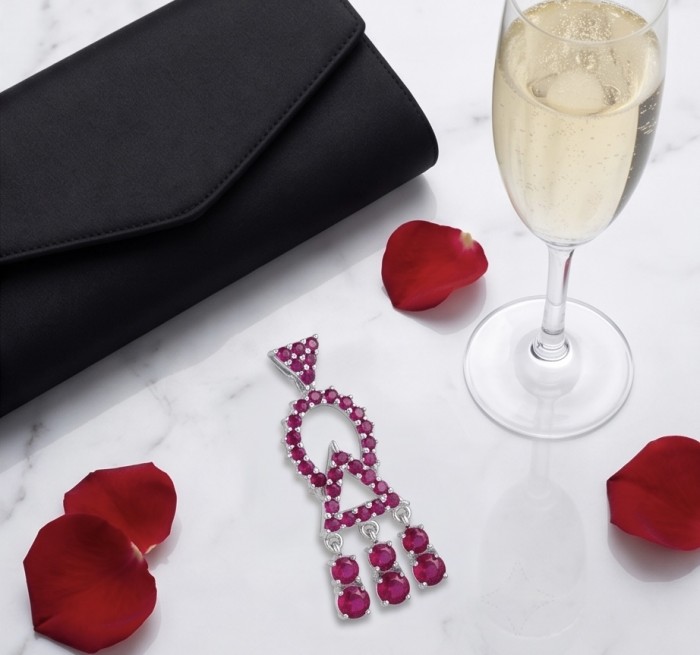 Precious - Art Deco 8.2 carat Ruby rhodium over .925 Sterling Silver handmade earrings - Art Deco ruby earring with clutch, champagne, and petals on marble table.